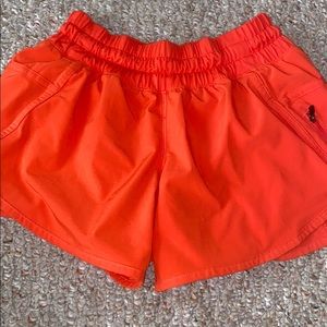 lululemon redish orange 4 inch shorts barely worn